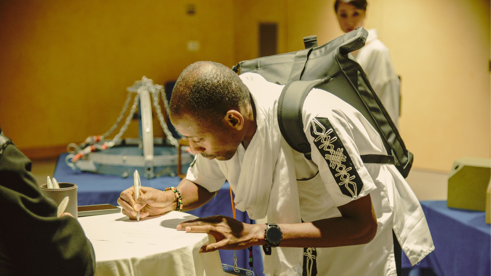 articipant signing the Heritage for Building Peace Appeal during the Stupore Ceremony